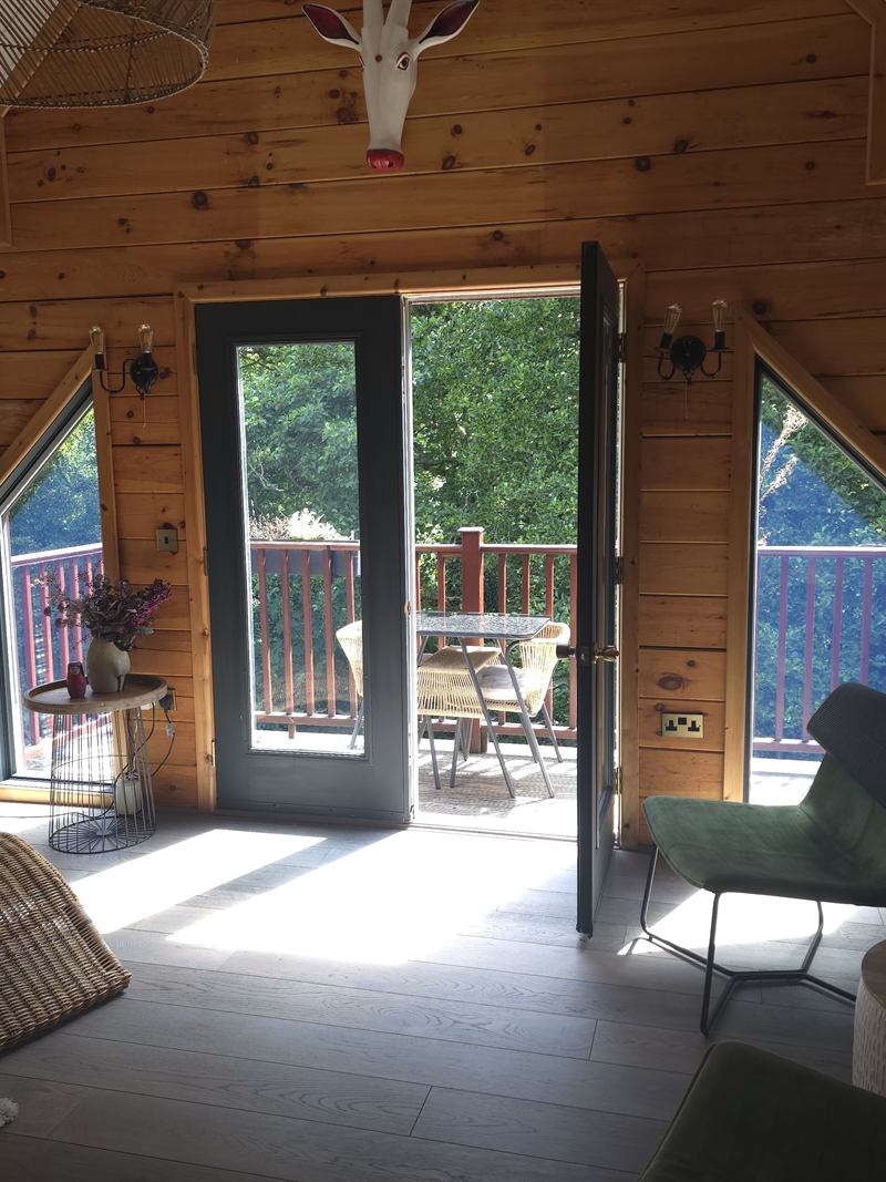The upstairs landing, opening onto a balcony above the garden